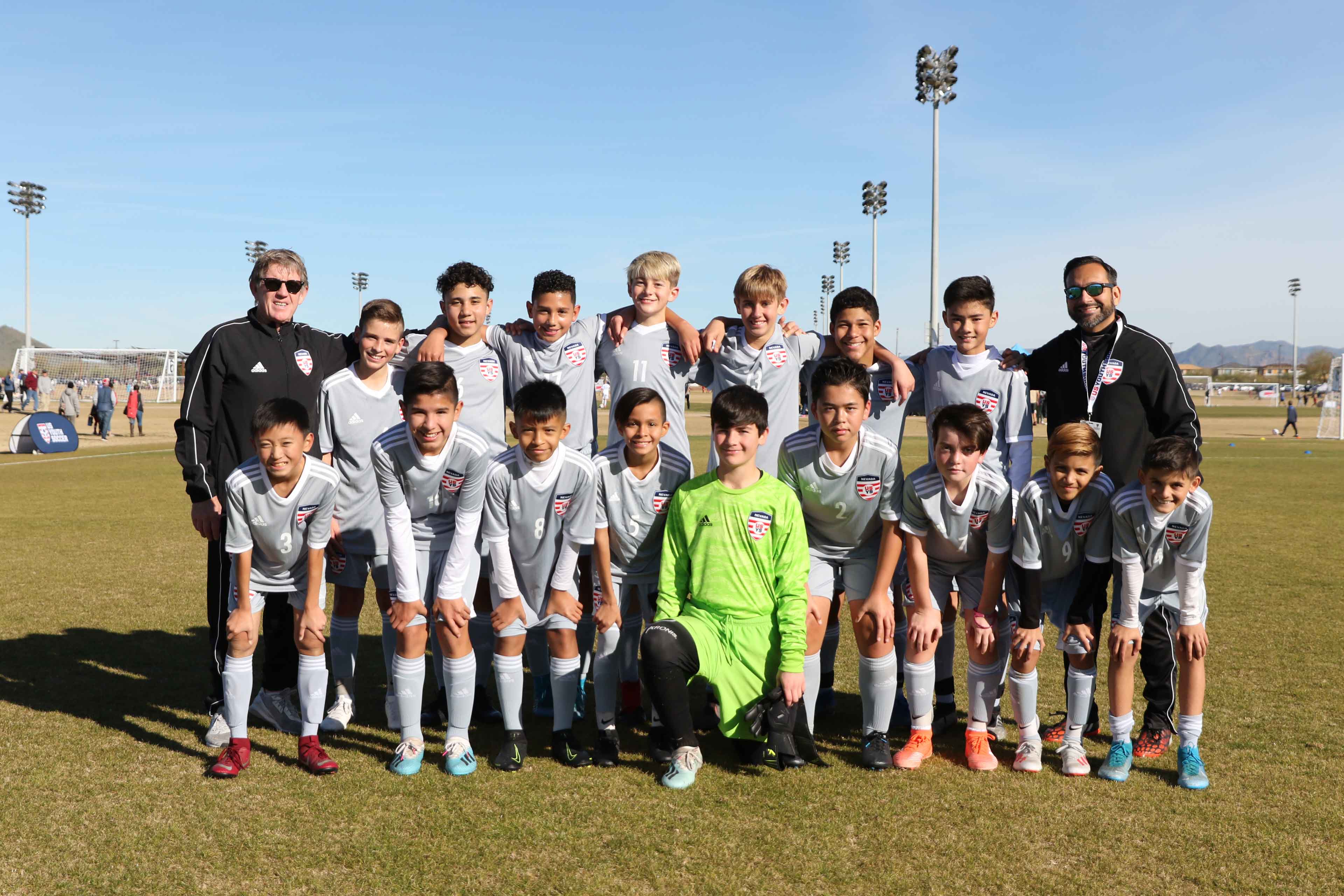 team of kids posing for a photo before an intense soccer match