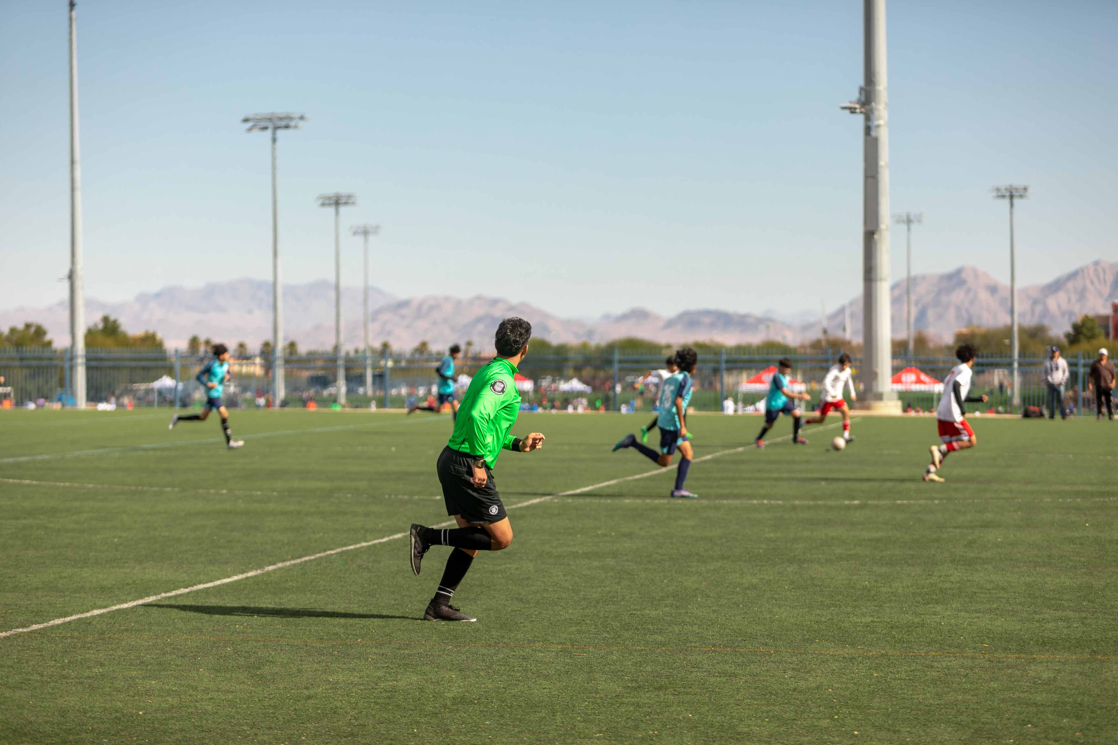 referee running on the field
