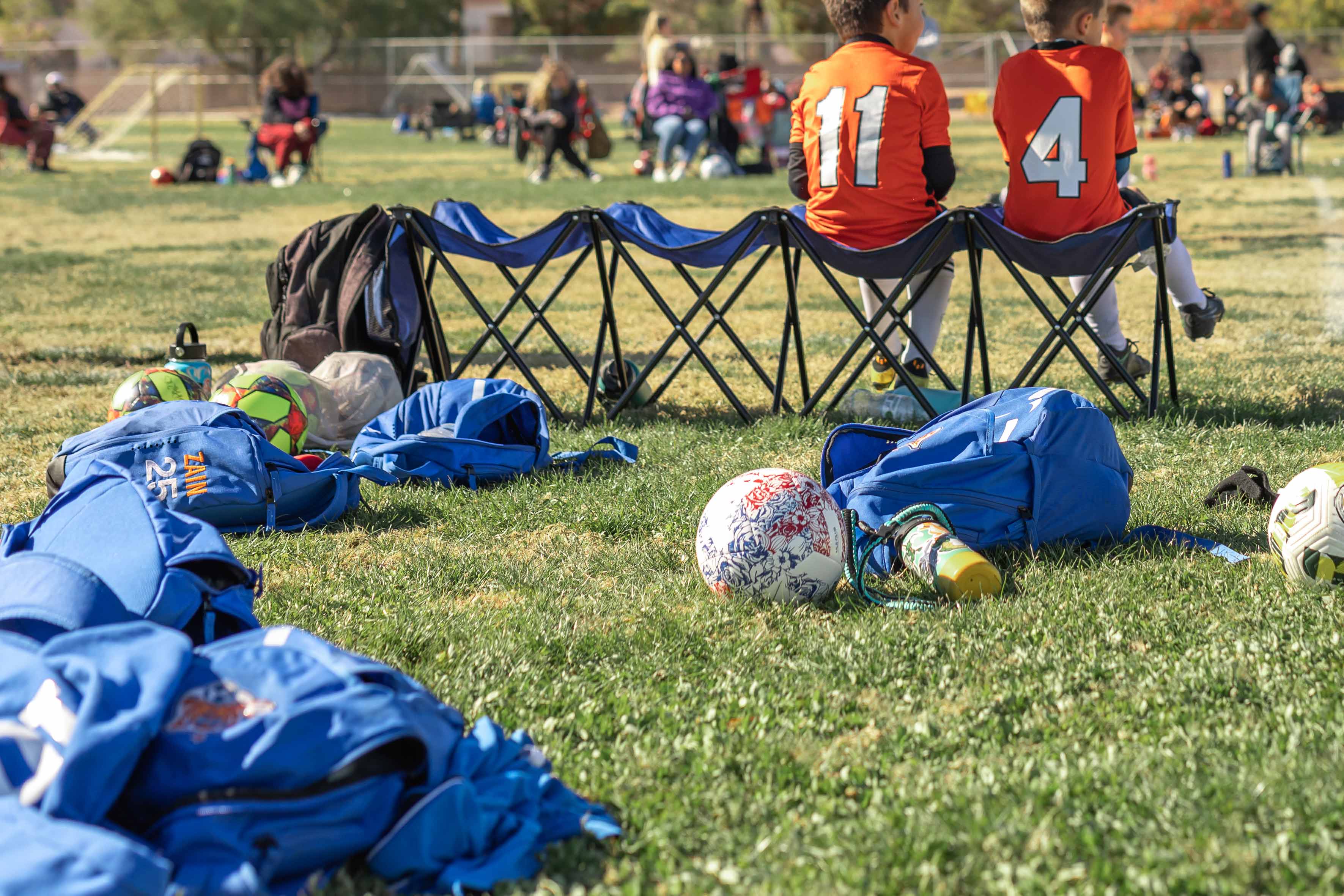 soccer items laying on the grass field